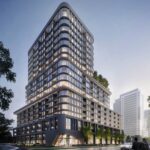 Exterior view of The Greenwich Condos at dusk.